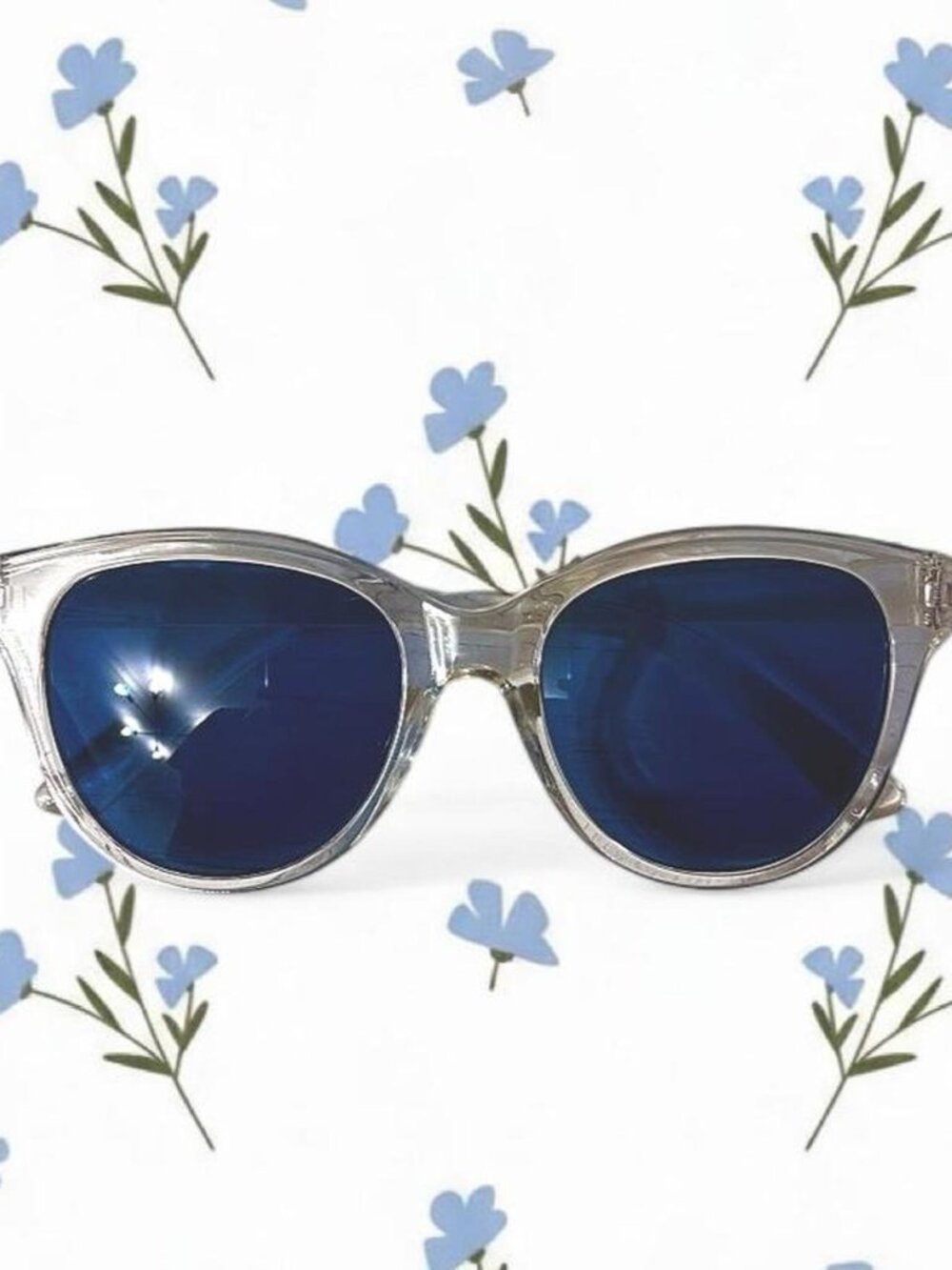 Clear frame sunglasses with blue lenses